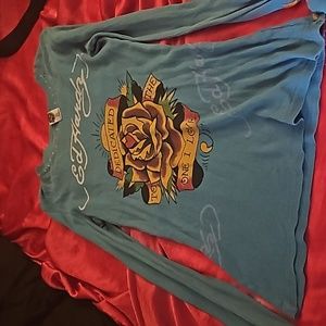 Ed Hardy long sleeve top with flowers and white stitching, which is very unique.